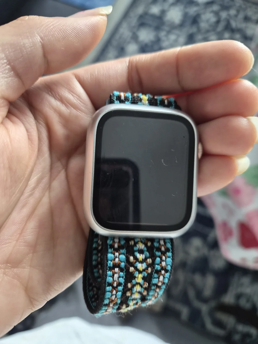 Apple Smartwatch with Black Case and Teal Patterned Woven Band